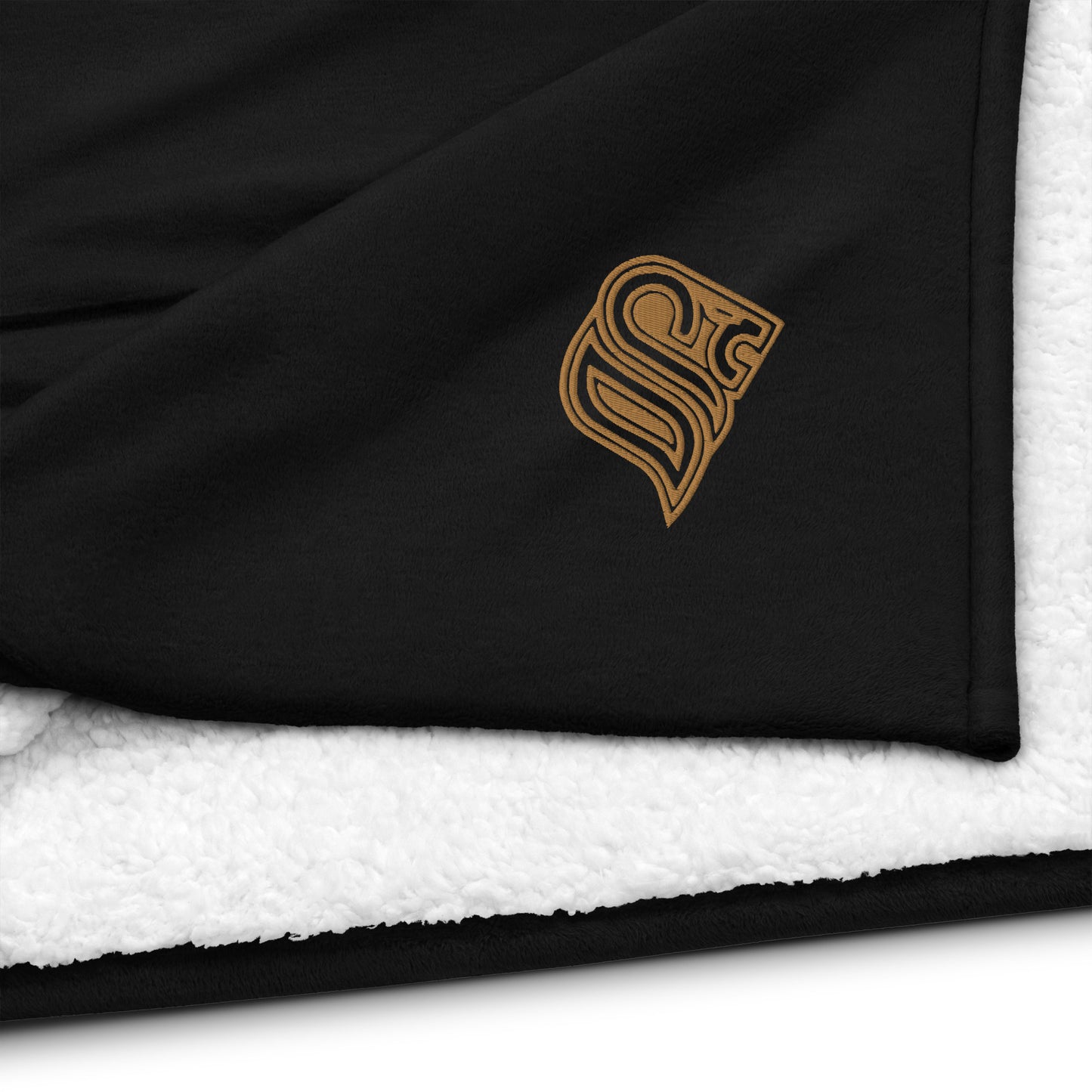 Embroidered logo sherpa blanket