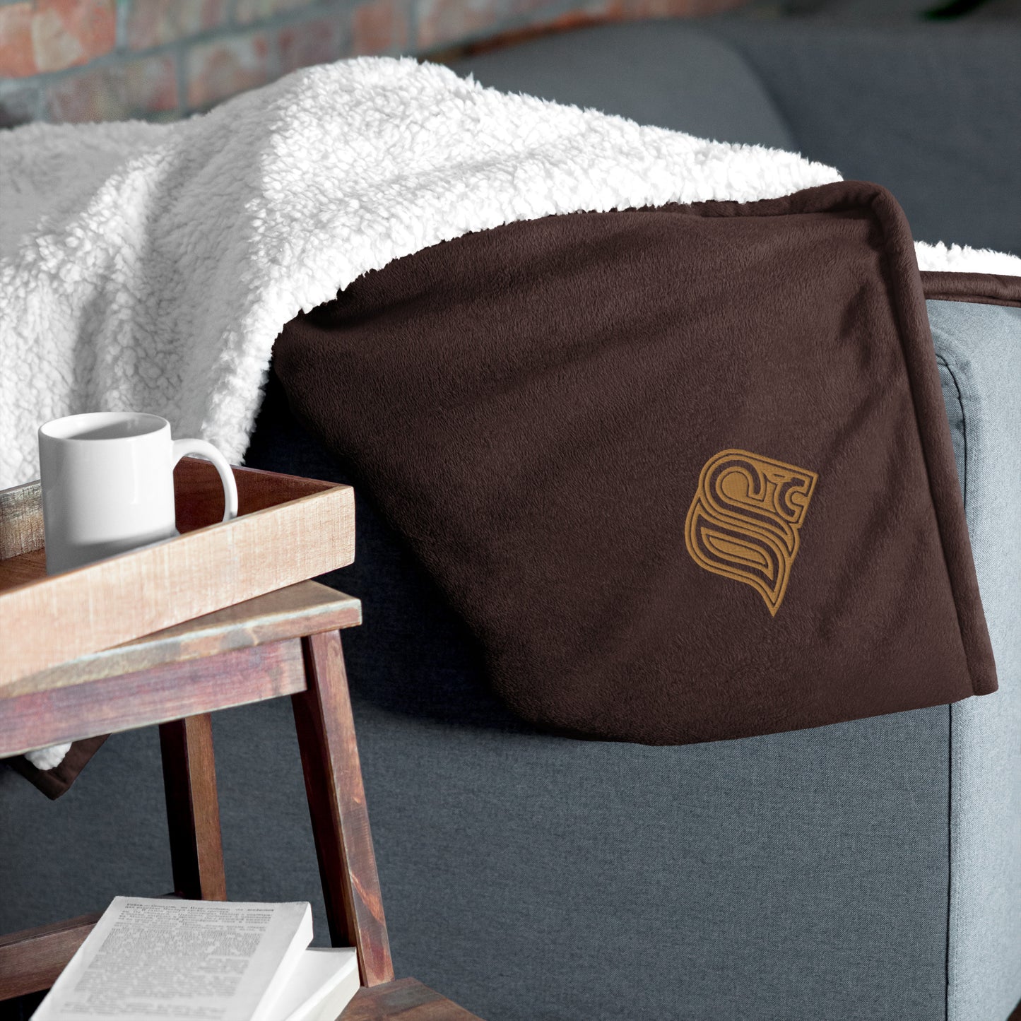 Embroidered logo sherpa blanket