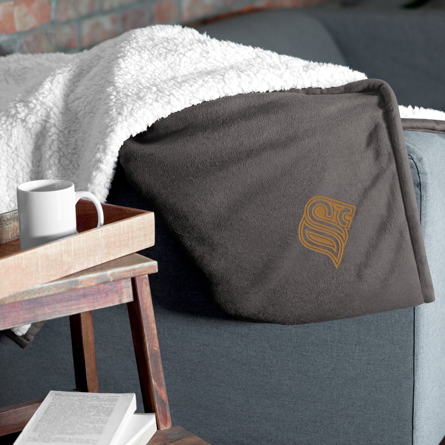 Embroidered logo sherpa blanket