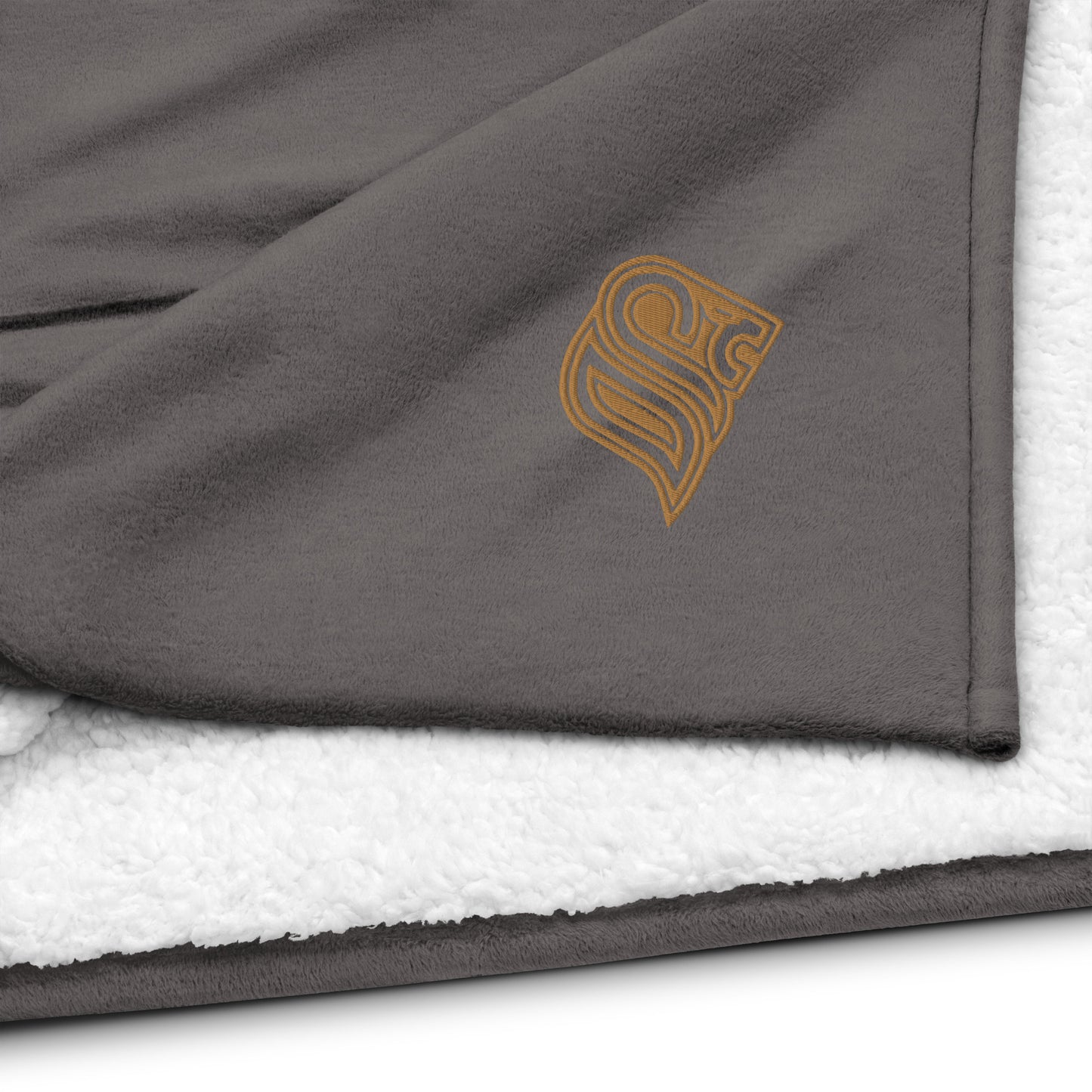 Embroidered logo sherpa blanket
